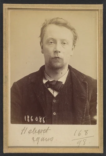 Hébert. Georges, Henri. 27 (ou 29) ans, né à Bayeux (Calvados). Menuisier. Anarchiste. 23/4/92. by Alphonse Bertillon, photograph, 1892