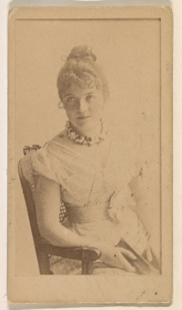 Seated actress, from the Actresses series (N245) issued by Kinney Brothers to promote Sweet Caporal Cigarettes by Kinney Brothers Tobacco Company, photograph, 1890