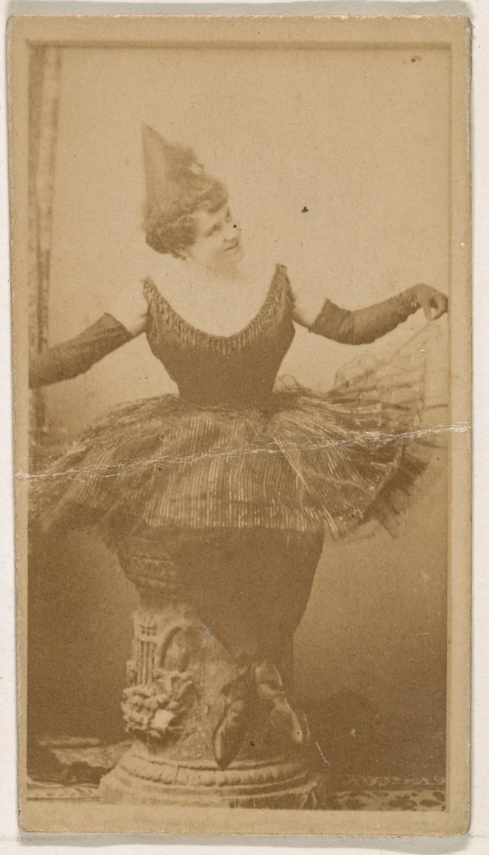 Seated dancer holding skirt, from the Actresses series (N245) issued by Kinney Brothers to promote Sweet Caporal Cigarettes by Kinney Brothers Tobacco Company, photograph, 1890