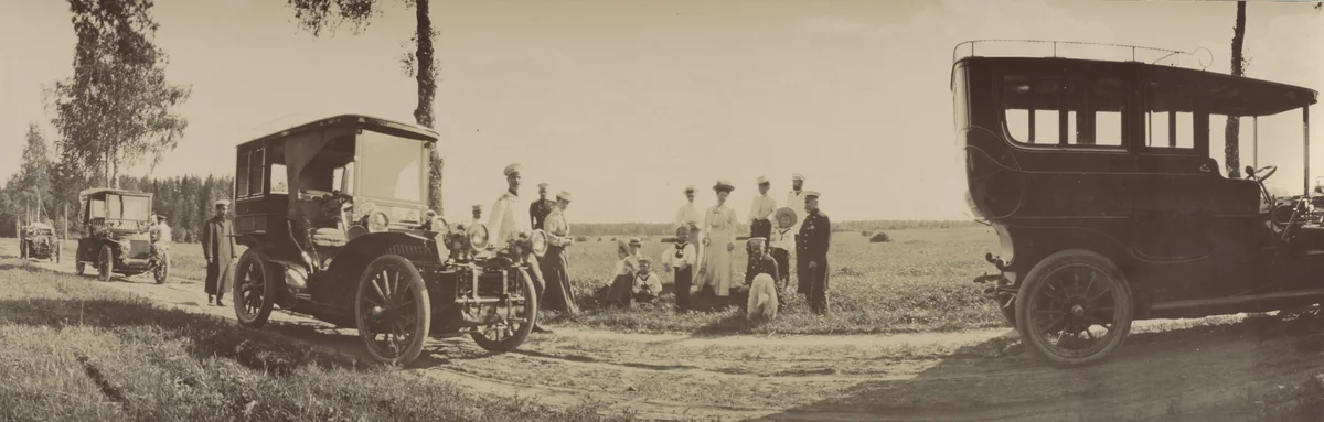 Grand Duke Alexander with His Wife Grand Duchess Xenia Alexandrovna Together with Their Children, Dog, Two Cars and Xenia's Brother, Grand Duke Michael Alexandrovich by Unidentified Photographer, photograph, 1903