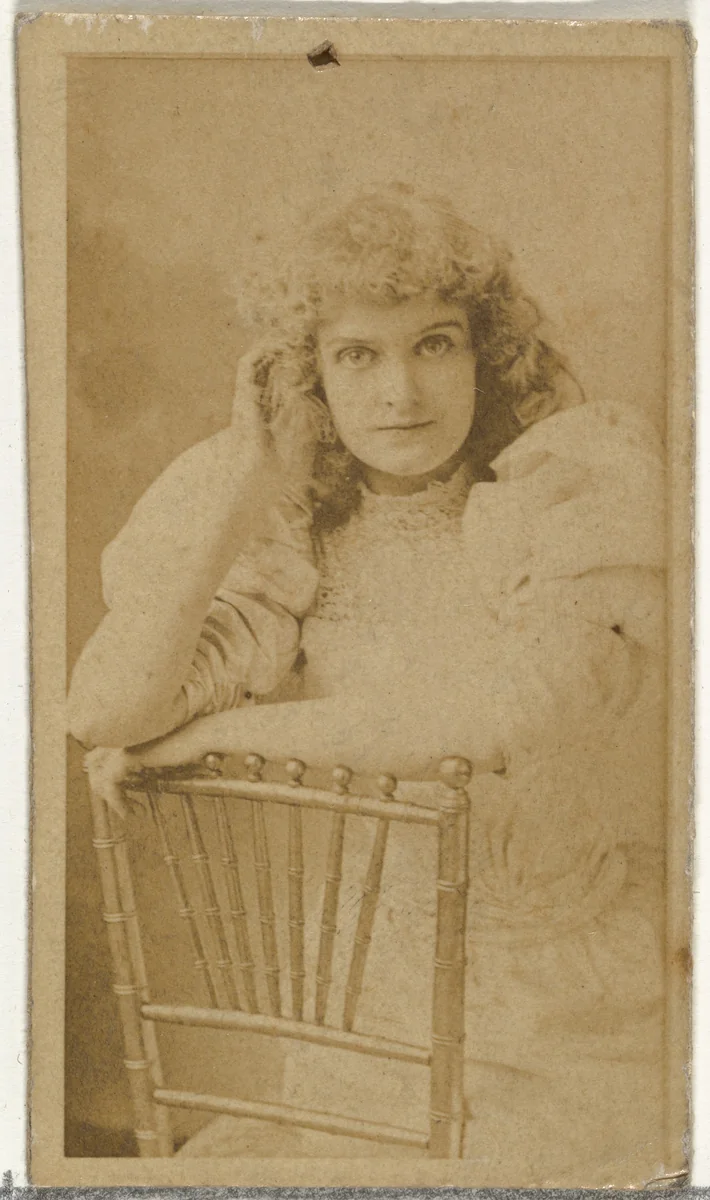 [Actress posing on chair], from the Actors and Actresses series (N145-8) issued by Duke Sons & Co. to promote Duke Cigarettes by W. Duke, Sons & Co., photograph, 1890-1895