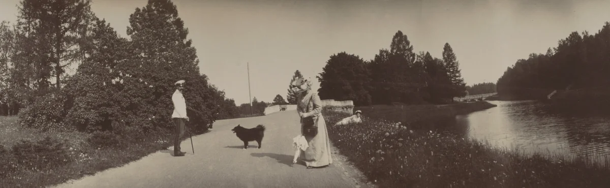 Grand Duke Georgii Mikhailovich Standing on Right, Grand Duchess Olga Alexandrovna Lying in Grass by Unidentified Photographer, photograph, 1903