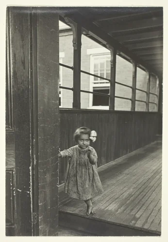 Little Girl Standing At Entrance To A Gallery by Lewis Wickes Hine, photograph, 1909