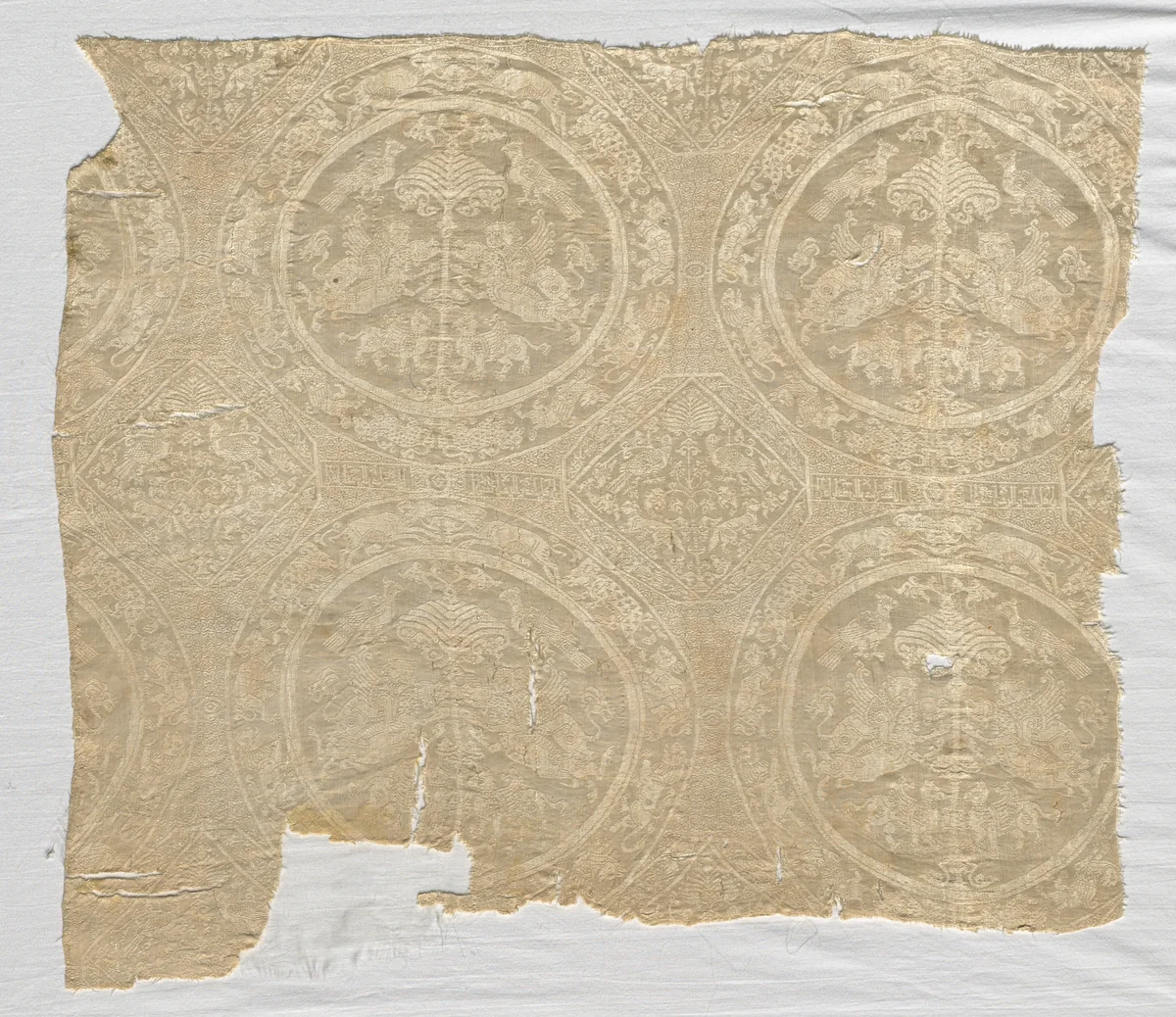 Fragment with confronted animal medallions and kufic bands by Unknown, textile, 1480-1649