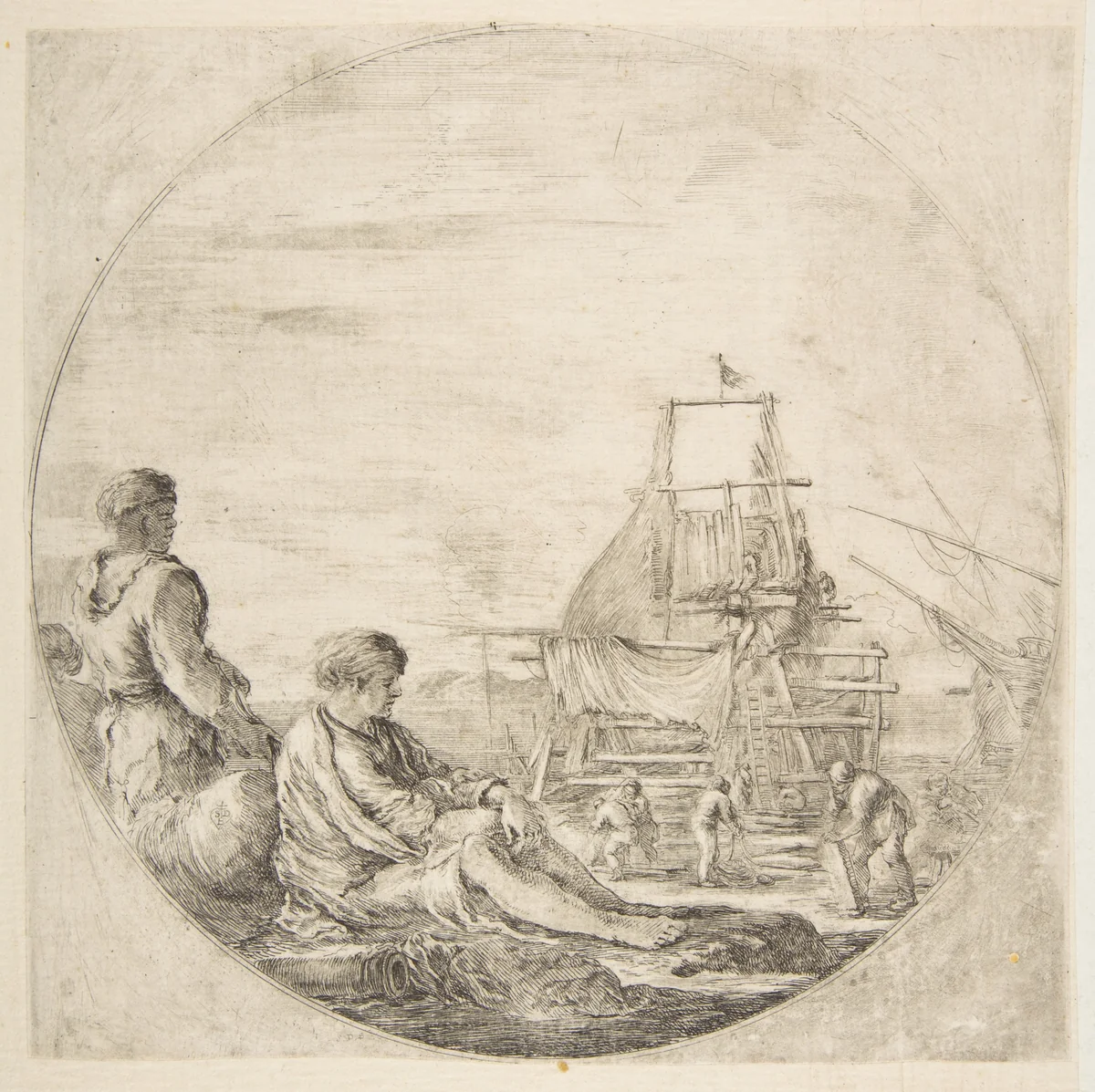 A seated white sailor and a standing black sailor, people building a ship in the background, a circular composition by Stefano della Bella, print, 1655-1665