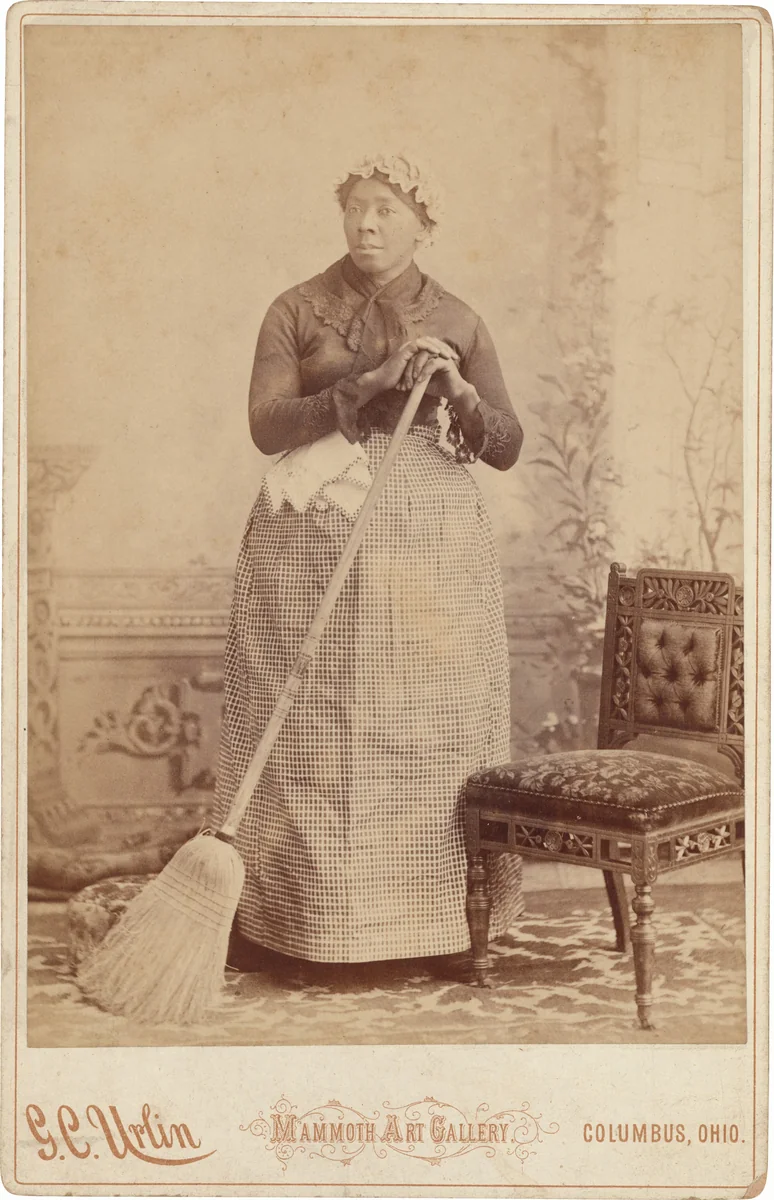 Portrait of a Woman with a Broom by G. C. Urlin, photograph, 1880-1890