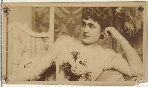 [Actress lounging while holding bouquet of flowers], from the Actors and Actresses series (N145-8) issued by Duke Sons & Co. to promote Duke Cigarettes by W. Duke, Sons & Co., photograph, 1890-1895
