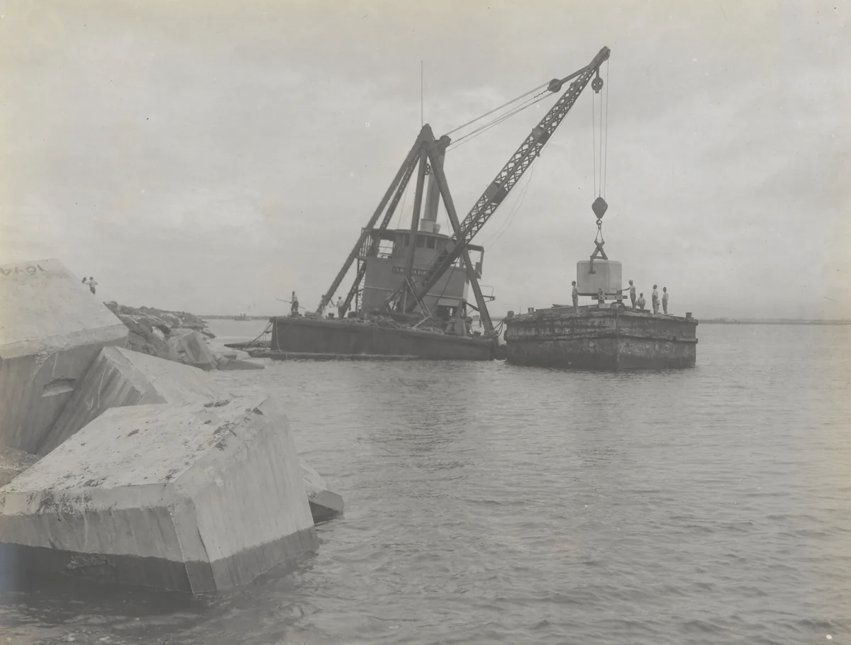 Toro Point Breakwater. Derrick barge placing 25-ton concrete blocks on bay slope by Unidentified Photographer, photograph, 1915