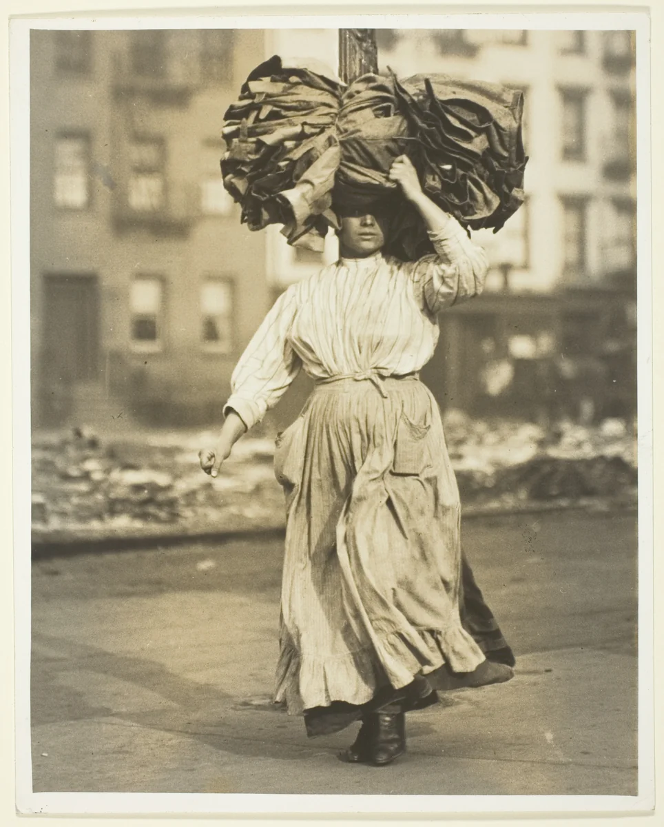 First Work in America, Italian Immigrant Carries Garments To The Tenement Home by Lewis Wickes Hine, photograph, 1910