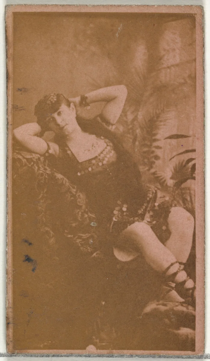 [Reclining actress with hands behind head], from the Actors and Actresses series (N145-8) issued by Duke Sons & Co. to promote Duke Cigarettes by W. Duke, Sons & Co., photograph, 1890-1895