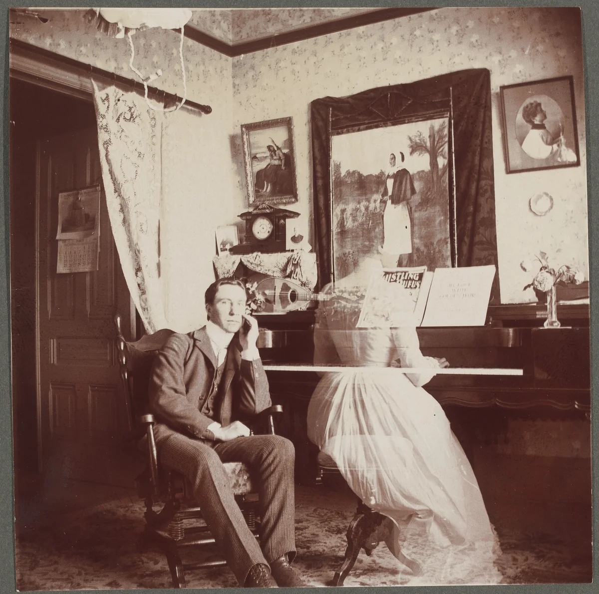 Untitled (Man with female "ghost" at the piano) by American 20th Century, photograph, 1890-1910