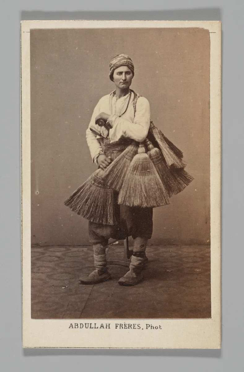 [Studio Portrait: Person with Brooms, Syria] by Abdullah Frères, photograph, 1860-1879