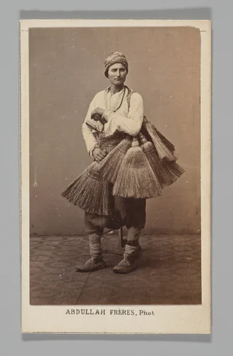 [Studio Portrait: Person with Brooms, Syria] by Abdullah Frères, photograph, 1860-1879
