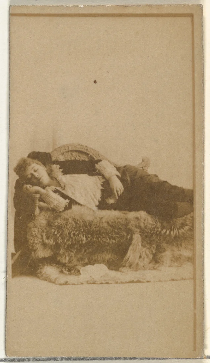 [Actress reclining on furs], from the Actors and Actresses series (N145-8) issued by Duke Sons & Co. to promote Duke Cigarettes by W. Duke, Sons & Co., photograph, 1890-1895