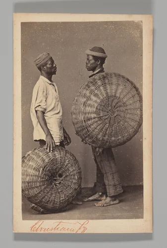 [Studio Portrait: Two Male Street Vendors in Profile with Baskets, Brazil] by Christiano Junior, photograph, 1864-1866