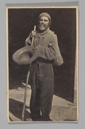 [Studio Portrait: Man with Walking Stick Begging (?)] by Le Vot, photograph, 1860-1879