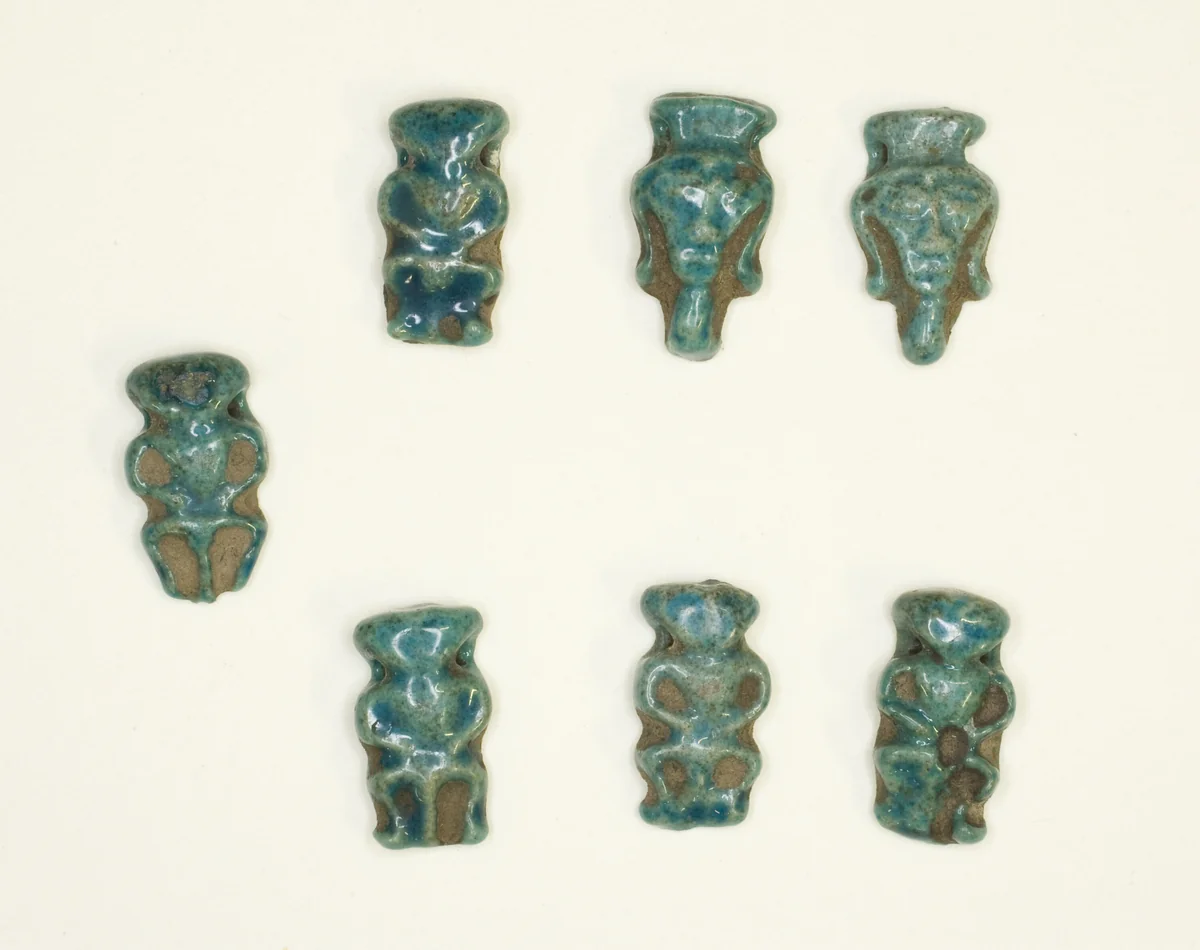 Amulets of the God Bes and the Goddess Hathor by Egyptian, metalwork, -1550--1295