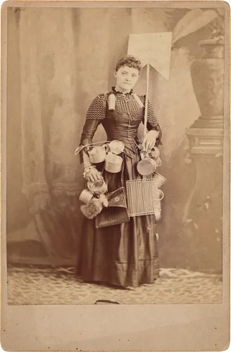Portrait of a Tinware Advertising Woman by Conrad Rippel, photograph, 1885-1899