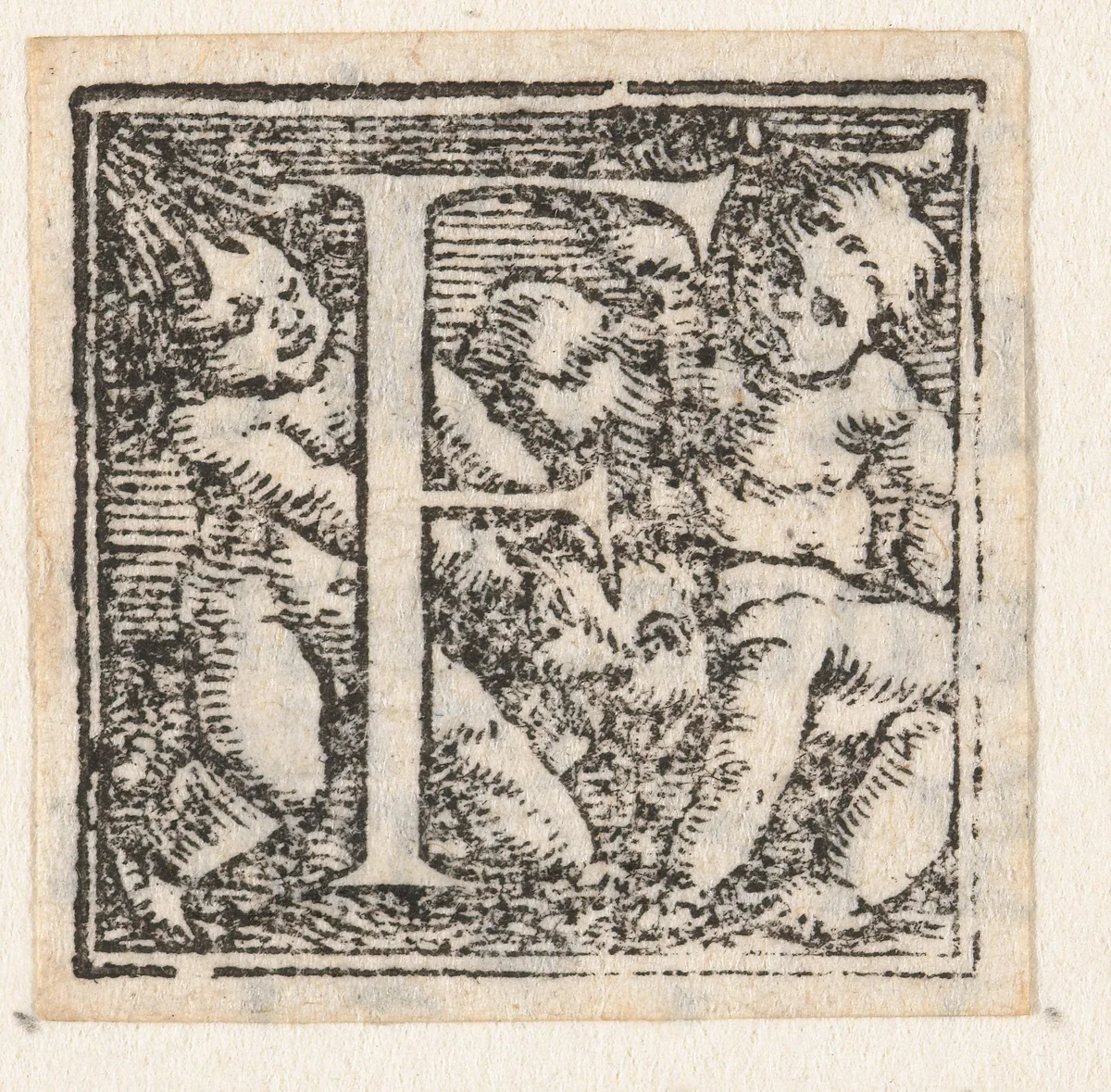 Letter F met drie kinderen van wie een kind op handen en voeten staat by Hans Holbein, print, 1522-1526