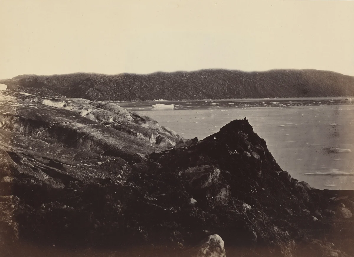 The Arctic Regions: No. 36. The Glacier As Seen Flowing Or Being Forced Down Between The Hills, Ploughing Up A Moraine Of Earth And Rocks, Twenty To Thirty Feet High by John L. Dunmore, photograph, 1869