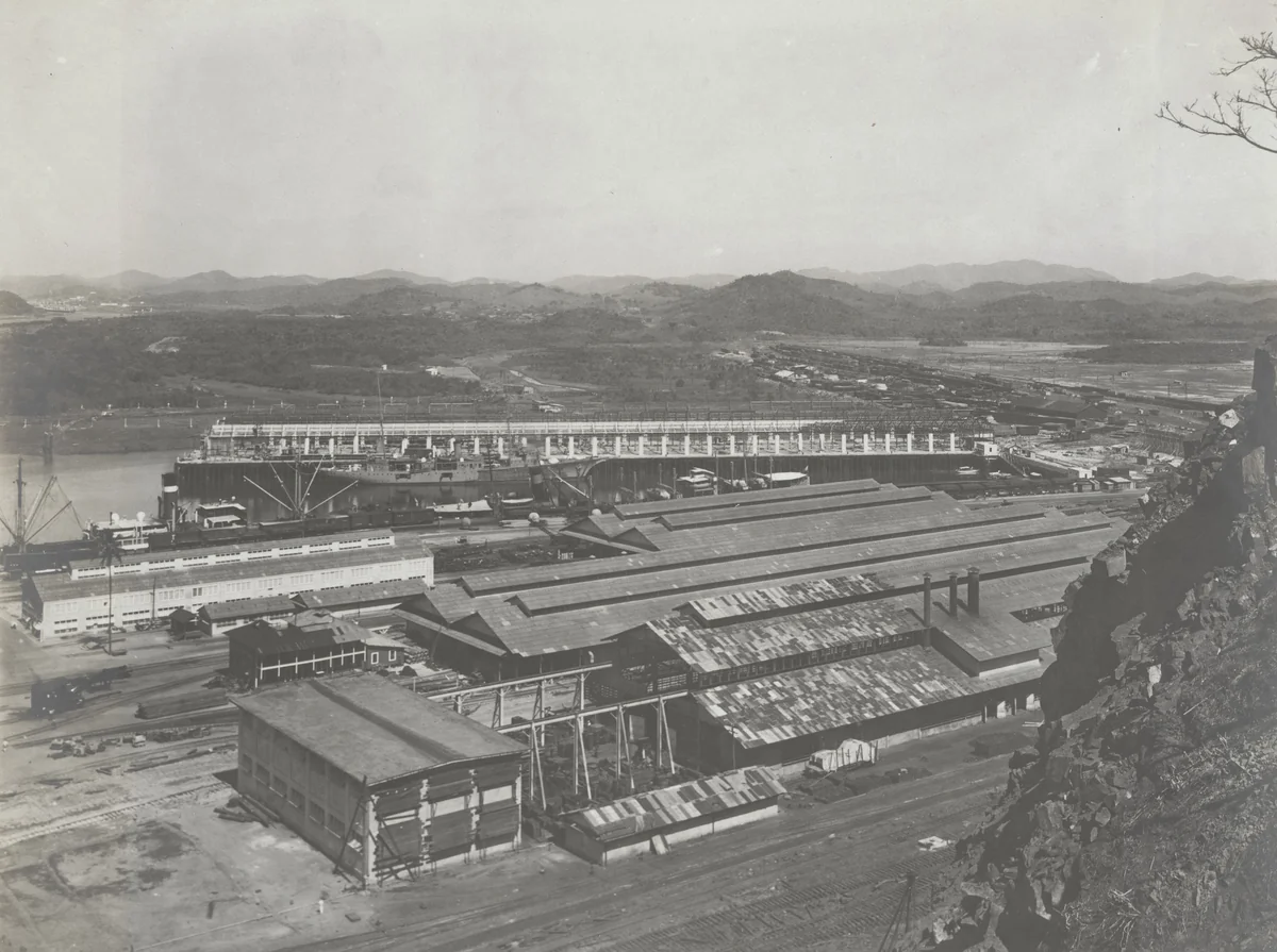 Balboa Terminals. Looking north from Sosa Hill. Concrete Walls in progress on pier No. 18. Buildings in foreground protected from blasting by Unidentified Photographer, photograph, 1916