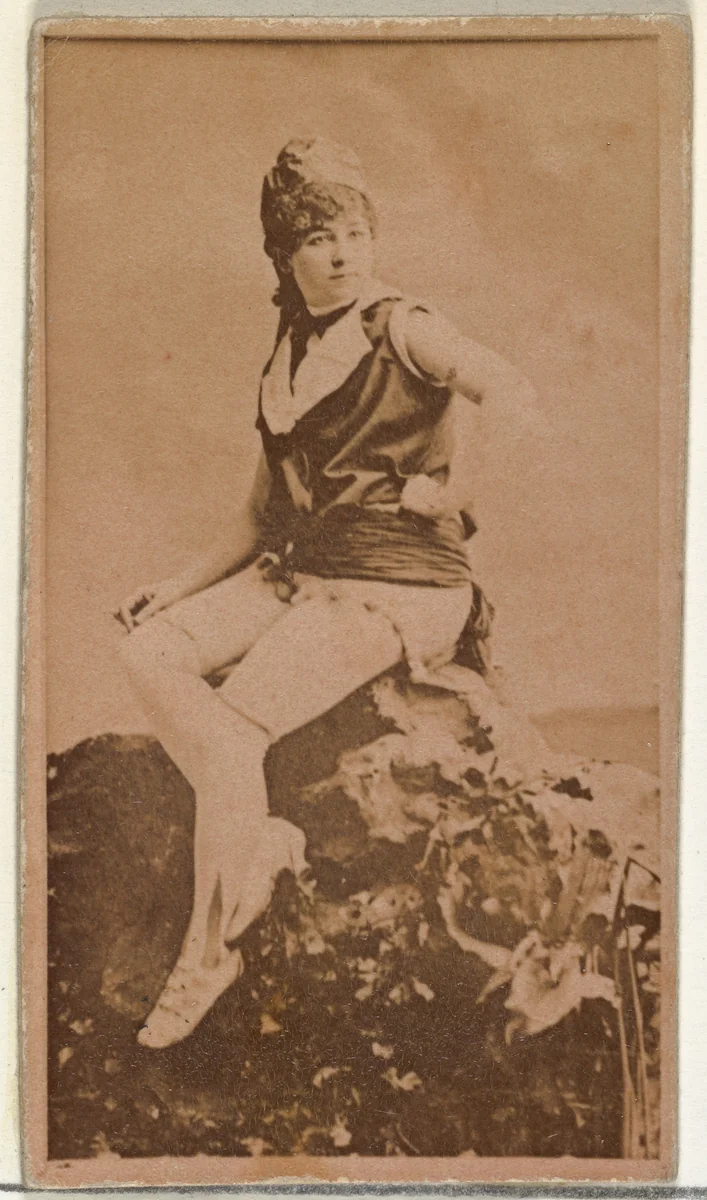 [Actress in studio posing on prop boulder], from the Actors and Actresses series (N145-8) issued by Duke Sons & Co. to promote Duke Cigarettes by W. Duke, Sons & Co., photograph, 1890-1895