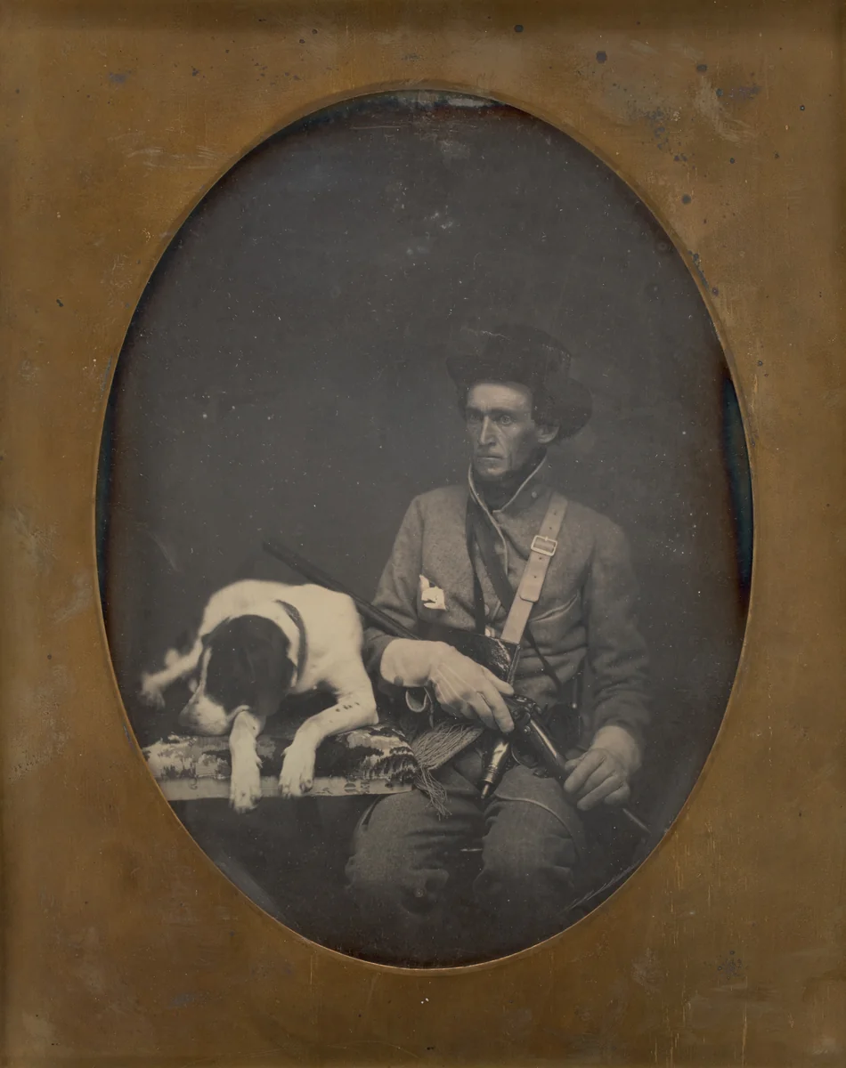 Untitled (Portrait of a Seated Man in Soldier Uniform with a Dog Lying to the Left of him) by Unknown maker, photograph, 1855
