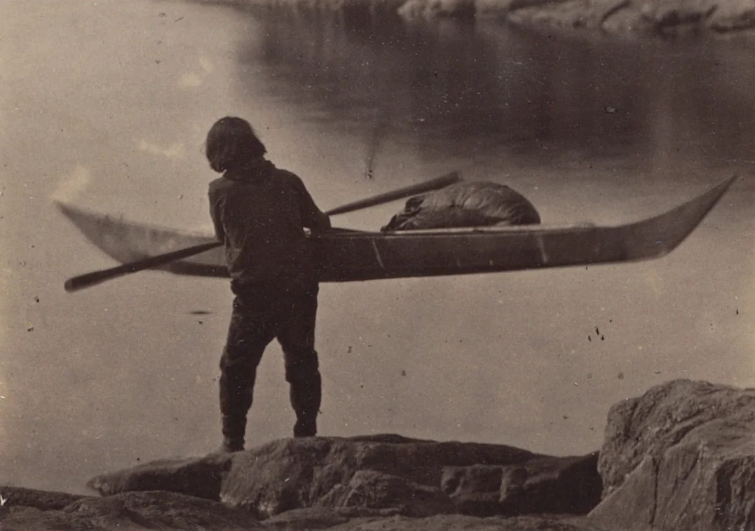 "Esquimaux carrying his kayak to the water to start on hunt" by George P. Critcherson, John L. Dunmore, William Bradford, photograph, 1869