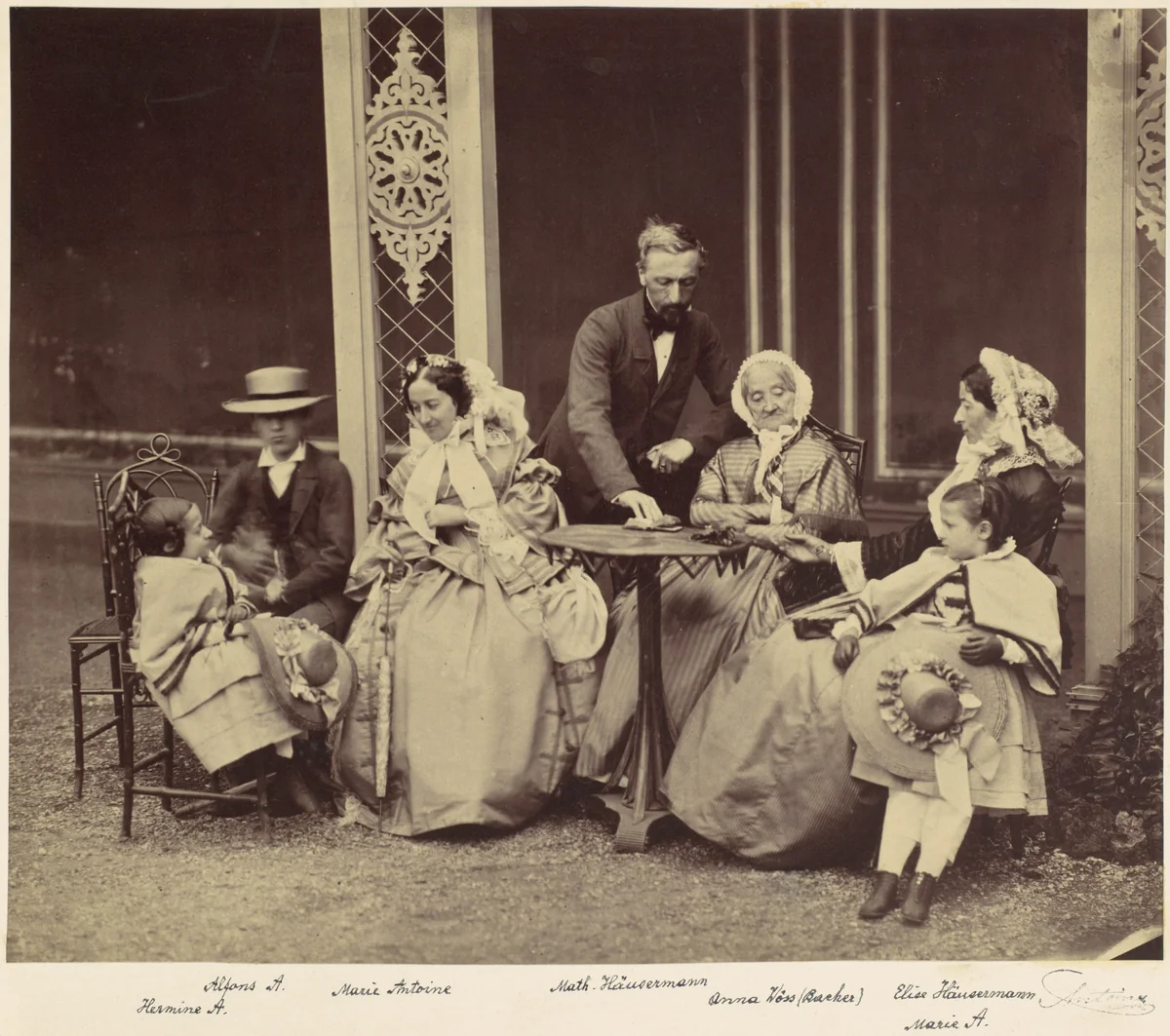 [Group Portrait of Five Adults and Two Children in a Garden] by Franz Antoine, photograph, 1850-1869