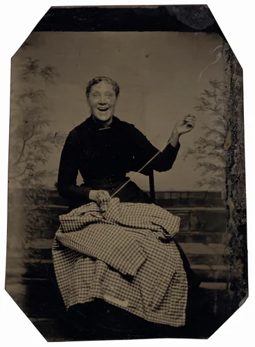 Portrait of a Woman Sewing by American 19th Century, photograph, 1840-1899