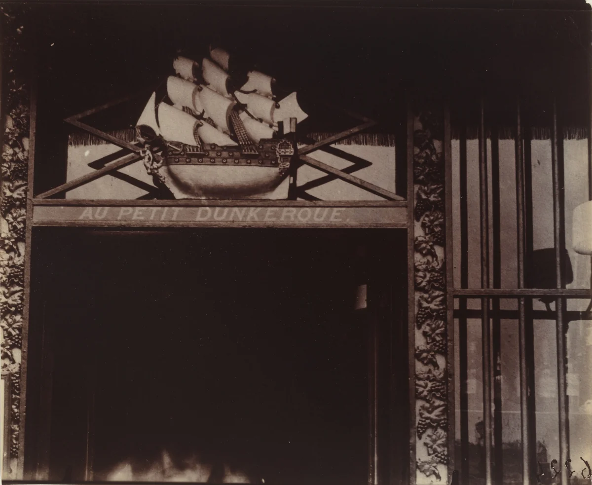 Au Petit Dunkerque, 3 quai Conti by Eugène Atget, photograph, 1900