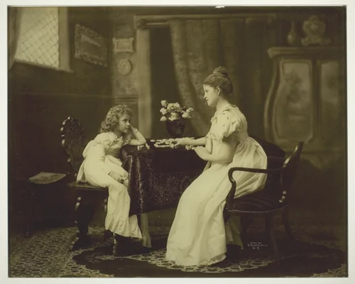 Woman and Child Playing Dominoes at Table by Artist Unknown, photograph, 1893-1903