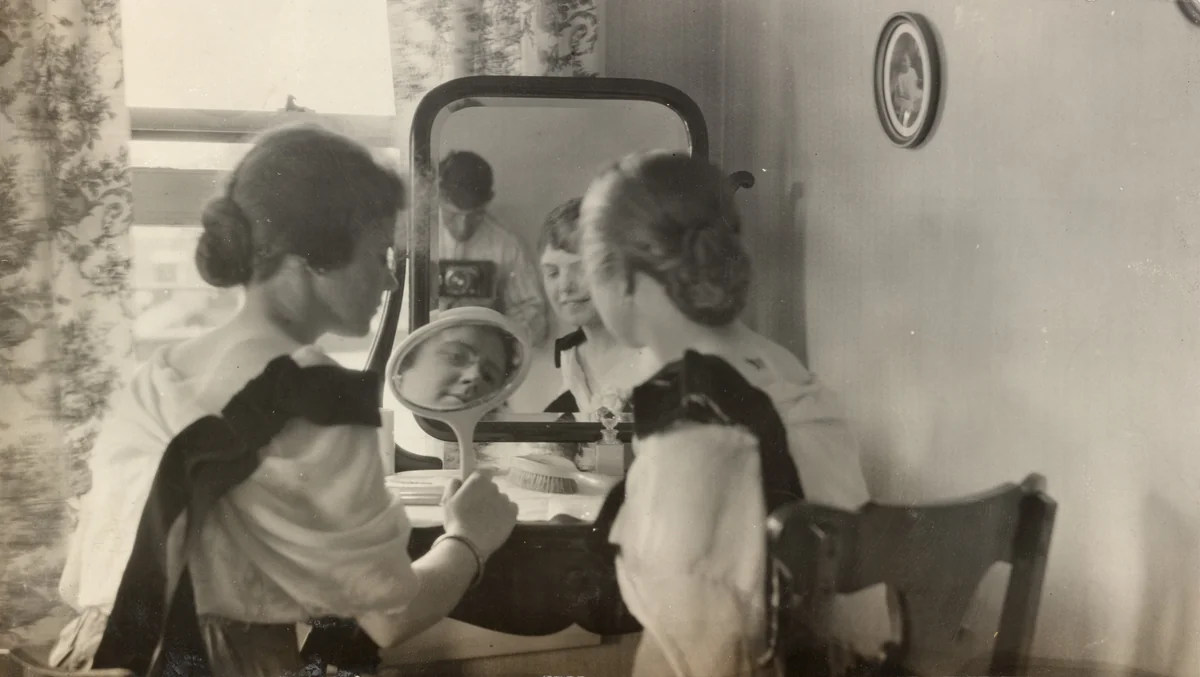 Untitled (Two women looking in mirror) by American 20th Century, photograph, 1900-1910