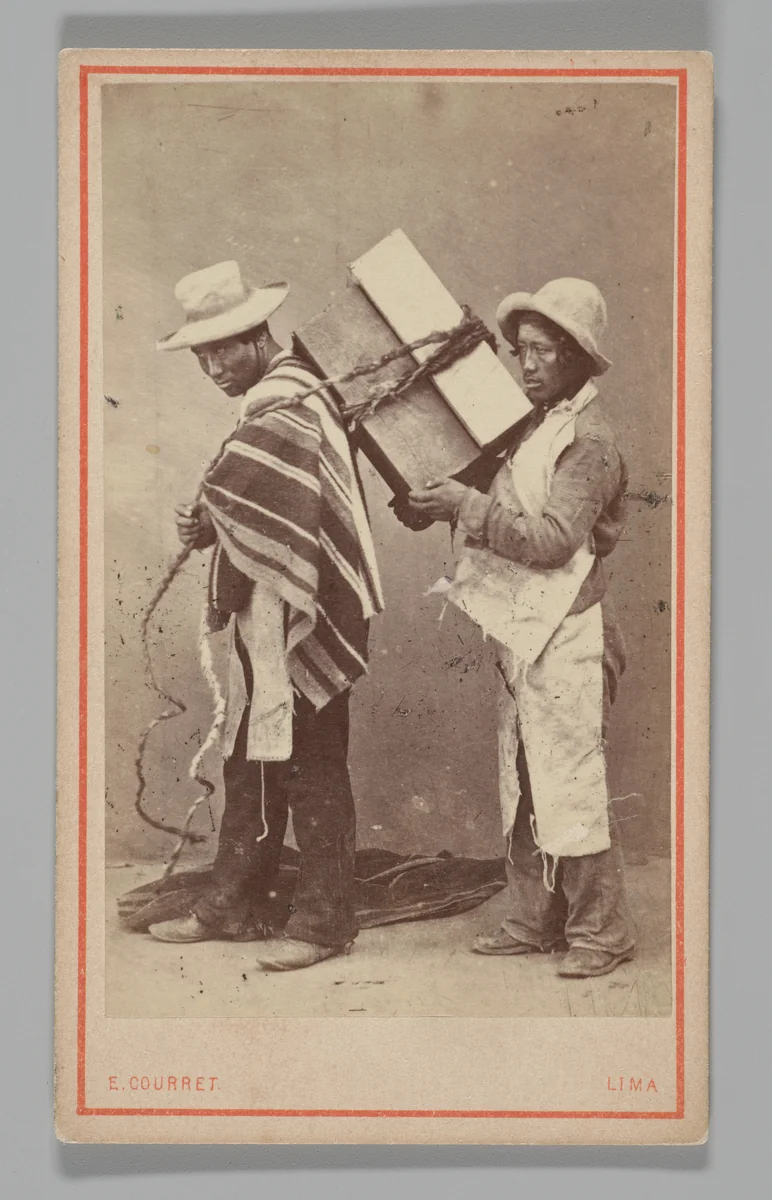 [Studio Portrait: Two Men, one with Box Tied to his Back, Lima] by Eugenio Courret, photograph, 1860-1879