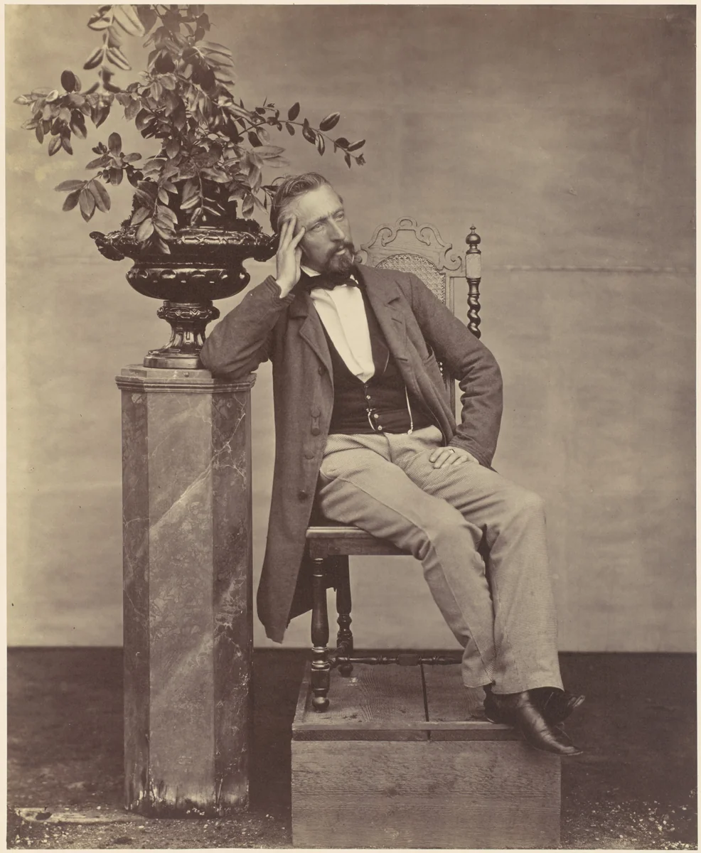 [Mathias Häusermann seated with elbow on pedestal holding a vase of flowers] by Franz Antoine, photograph, 1850-1869