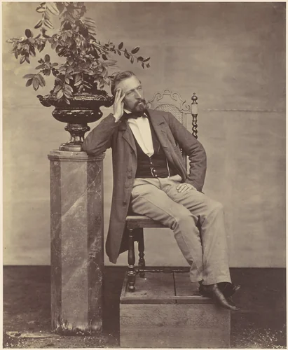 [Mathias Häusermann seated with elbow on pedestal holding a vase of flowers] by Franz Antoine, photograph, 1850-1869