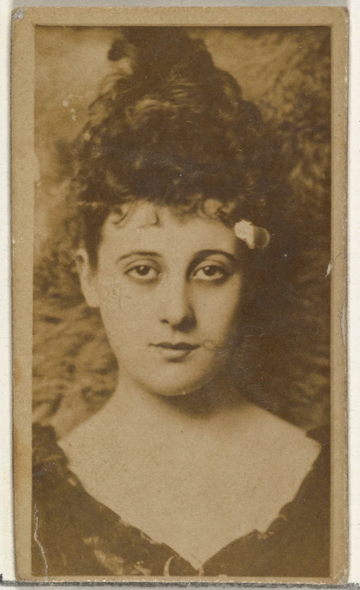 [Actress with dark hair piled on head], from the Actors and Actresses series (N145-8) issued by Duke Sons & Co. to promote Duke Cigarettes by W. Duke, Sons & Co., photograph, 1890-1895