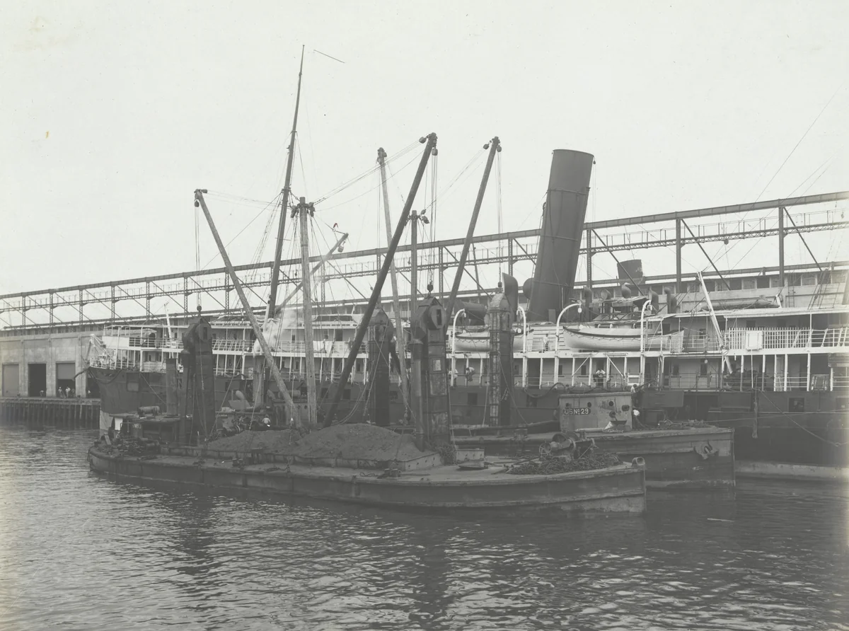 P.R.R. Coal Barges equipped with two De Mayo coal conveyers each making delivery of bunker coal to steamer. Pier No. 8 Cristobal, C.Z by Unidentified Photographer, photograph, 1915