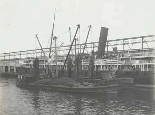 P.R.R. Coal Barges equipped with two De Mayo coal conveyers each making delivery of bunker coal to steamer. Pier No. 8 Cristobal, C.Z by Unidentified Photographer, photograph, 1915