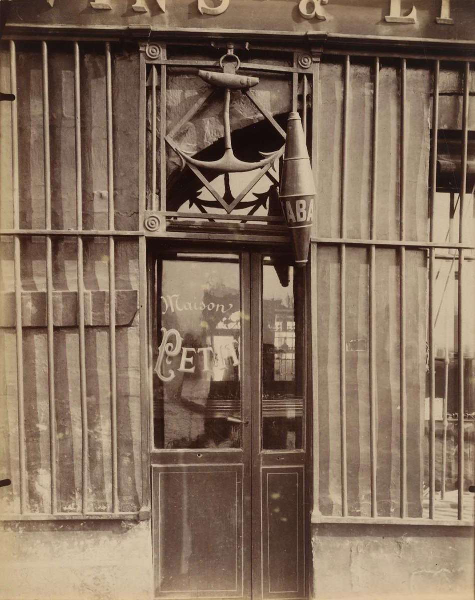 Enseigne, quai de Bourbon, 38 by Eugène Atget, photograph, 1901