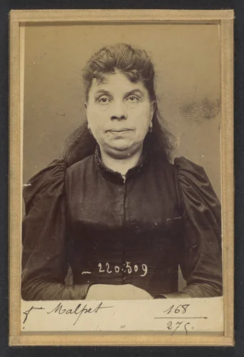 Malpet. Jeanne (femme Pivier). 51 ans, née en mai 42. Couturière. Anarchiste. 3/7/94. by Alphonse Bertillon, photograph, 1894