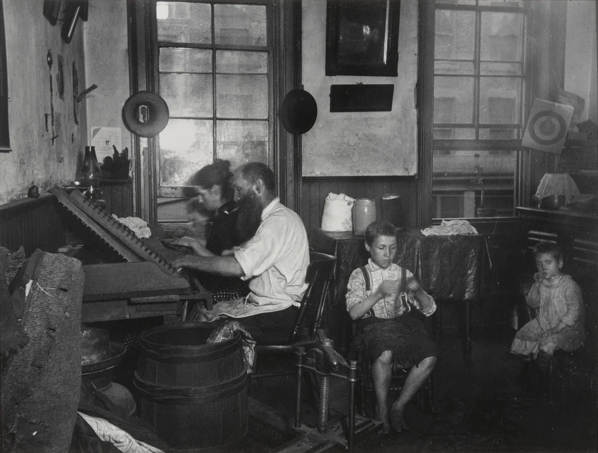 Bohemian Cigarmakers at Work in Their Tenement by Jacob August Riis, photograph, 1889