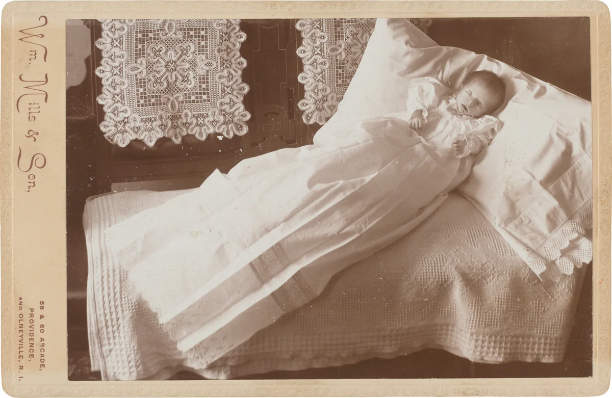 Post-Mortem Baby on Bed by William Mills & Son, photograph, 1880-1899