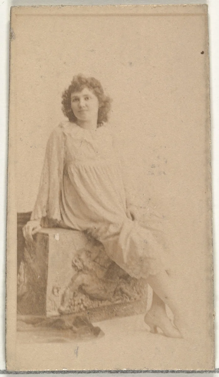 [Seated actress dressed in loose white gown], from the Actors and Actresses series (N145-8) issued by Duke Sons & Co. to promote Duke Cigarettes by W. Duke, Sons & Co., photograph, 1890-1895