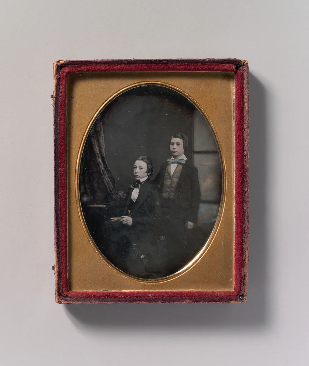 [Two Young Men in Bow Ties, One Seated Holding a Book, One Standing] by Robert Boning, photograph, 1850-1859