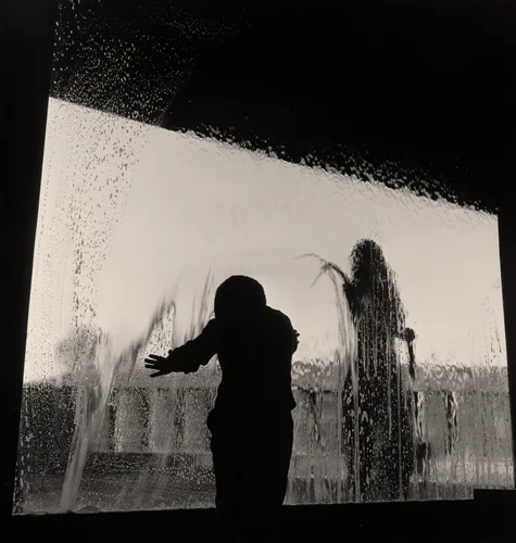 Peter and Joan Miller Washing Windows, Orinda, California by Wayne Miller, photograph, 1951