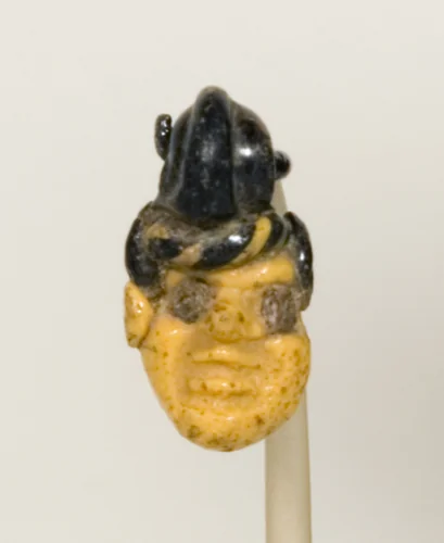 Pendant in the Shape of a Head by Phoenician, metalwork, -500--201