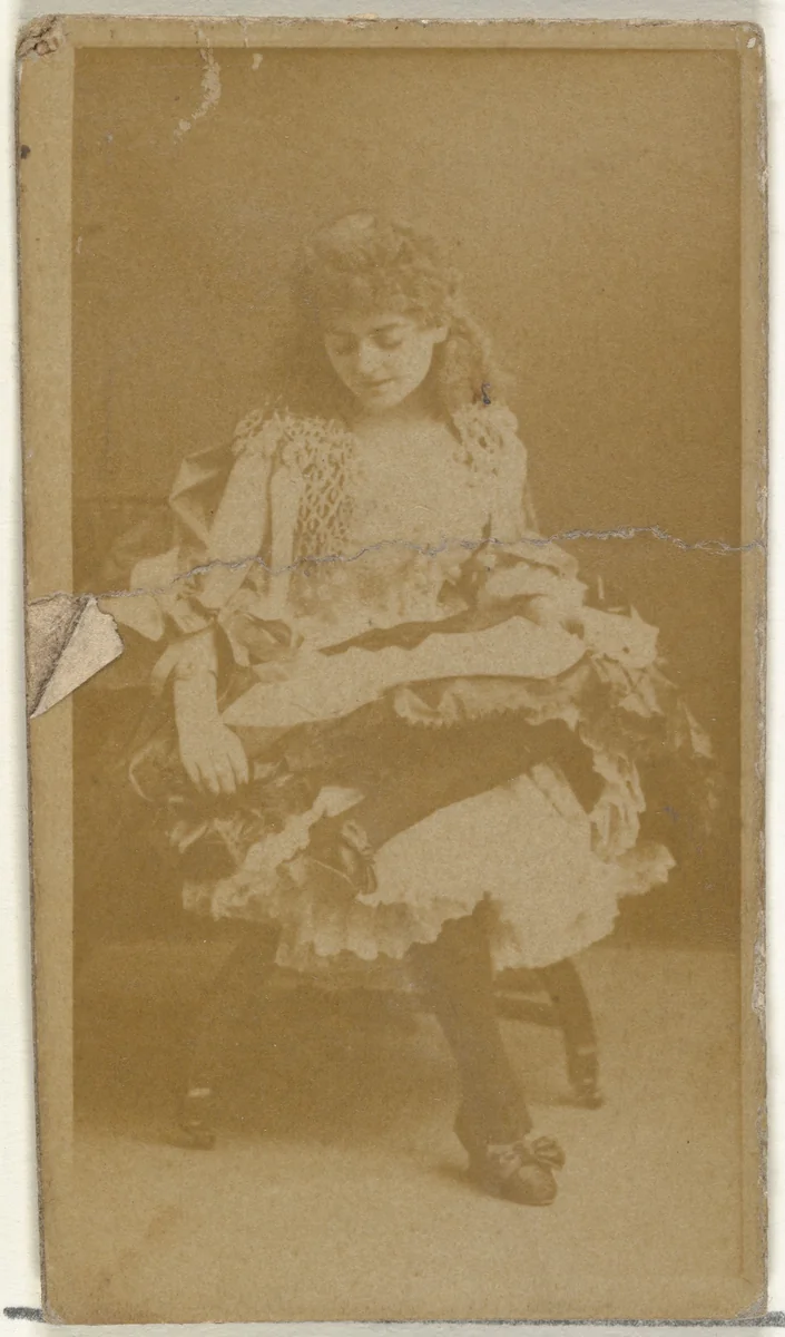 [Seated actress, looking down], from the Actors and Actresses series (N145-8) issued by Duke Sons & Co. to promote Duke Cigarettes by W. Duke, Sons & Co., photograph, 1890-1895