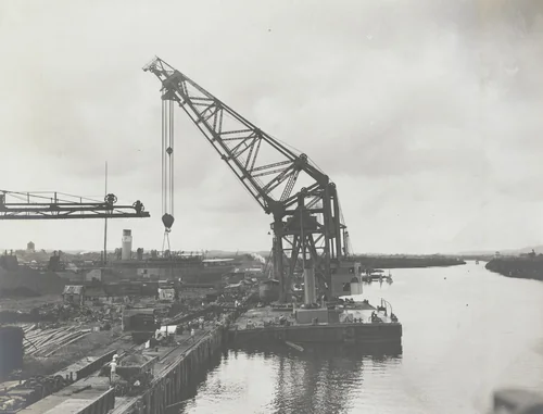 Floating crane "Ajax" test. Showing 112.8 ton test load (20% excess) on one hook at rated reach for 94 tons by Unidentified Photographer, photograph, 1915