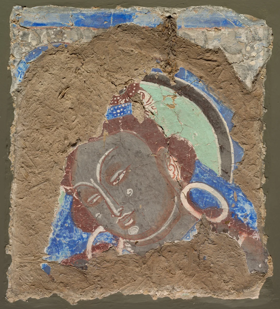Fragment with a Head of Bodhisattva by Unknown, painting, 600-650